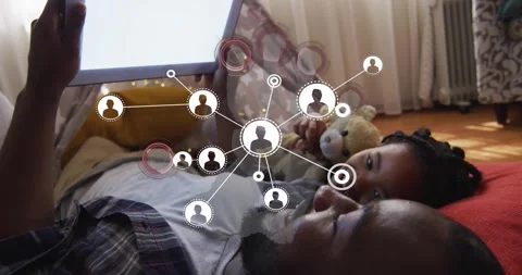 Dad holding tablet causing tech node map showing links on screen while daughter Stock Footage 321143177
