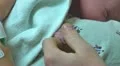 dad holds baby's hand first time Video HD