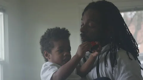 Dad Holds Young Son Playing With Train Vidéo 208734012