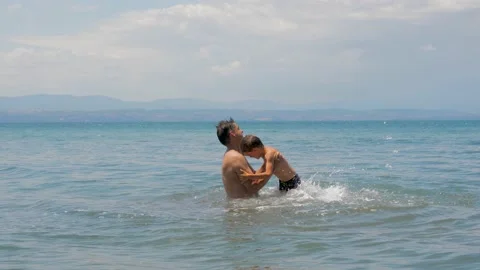 Dad with kid activity summer beach holiday. Sea vacation summer water freedom Stock Footage 152980170