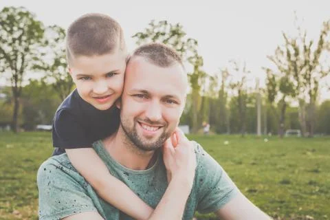 Dad with kid having fun outside Stock Photos