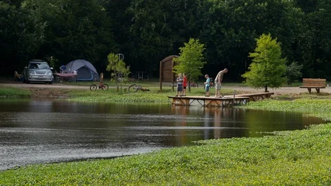 Dad with kids fishing 1080p Stock Footage 118490166