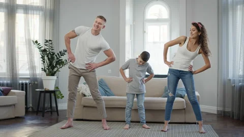 Dad Mom And Son Doing Exercise In The Apartment. 스톡 동영상 146618651