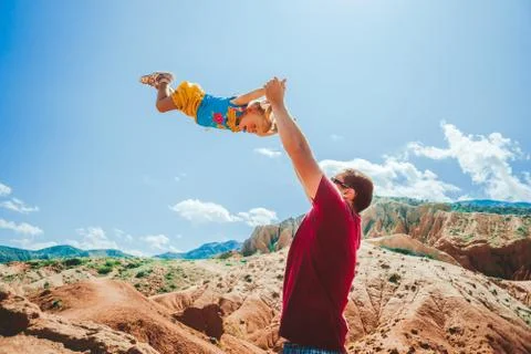 Dad picks up the child Stock Photos