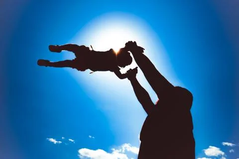 Dad picks up the child Stock Photos