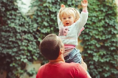 Dad picks up the child Stock Photos