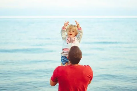 Dad picks up the child Stock Photos