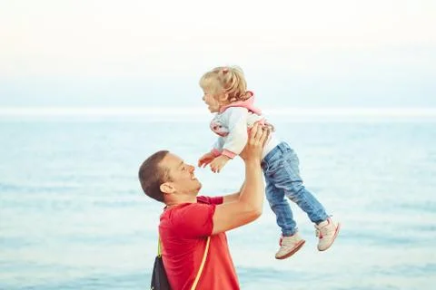 Dad picks up the child Stock Photos
