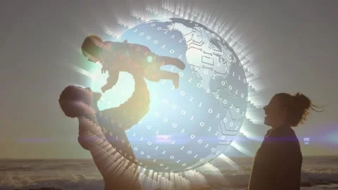 Dad playfully lifting infant on sunset shore, bonding while tech globe Stock Footage 330237329