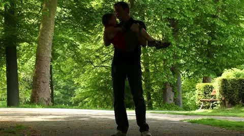 Dad playing with his son in the park Stock Footage 11062959