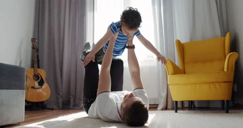 Dad plays and spends time with his younger son in the house together. Stock Footage 152680513