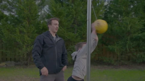 Dad Plays Tetherball With Son Stock Footage 208781863