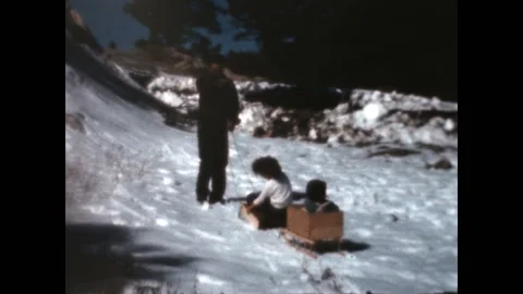 Dad Pulls the Sled 1939 Stock Footage 225595658