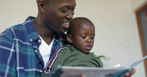 Dad reading to kid Video stock 119604957