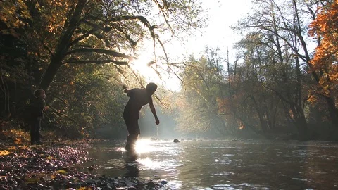 Dad Skipping Rocks With His Son At The River Stock Footage 81717788