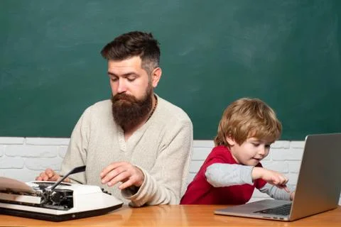 Dad son are concentrated on the problem. Daddy and son together. Concept of Stockfoto's
