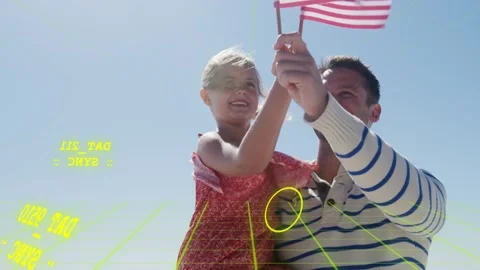 Dad steadying flags and lifting daughter, holding them for marketing with yellow Stock Footage 333859577