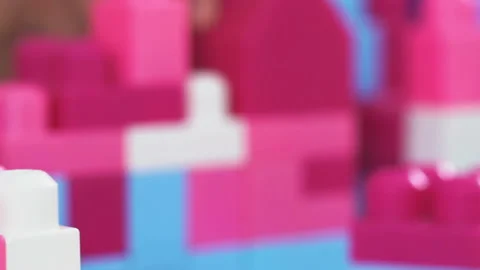 Dad talking to a son in construction helmets playing constructor bricks game Video stock 132509854