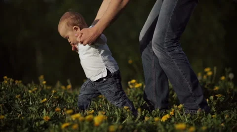 Dad teaches a young boy to go and show him something Stock Footage 55114908