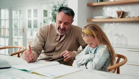 Dad, teaching and learning with difficult child in home for development cha.. Stock Photos