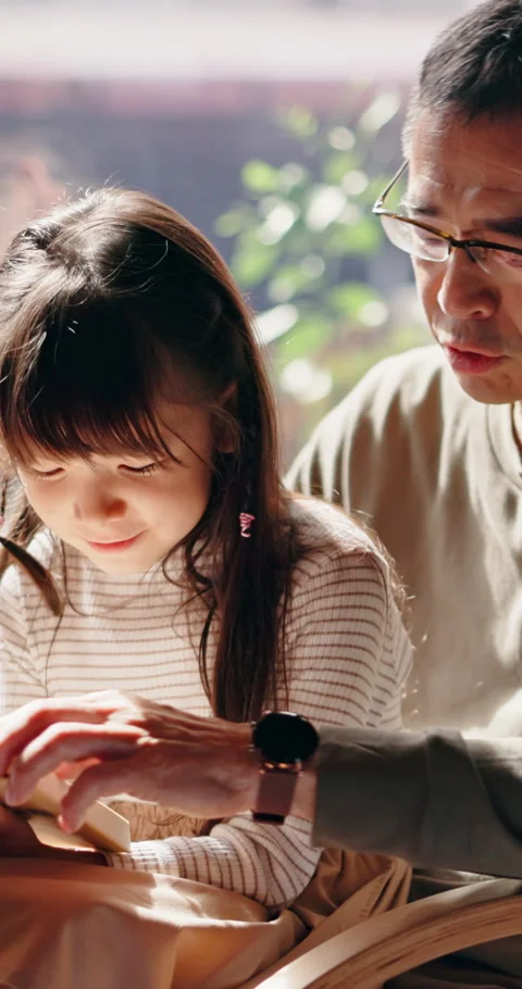 Dad, teaching and reading book in home with Asian child, knowledge or learn for Stock Footage 341091135