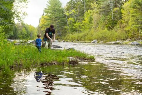 Dad teaching son to fish Stock Photos