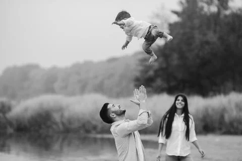 Dad throws up his young son Stock Photos