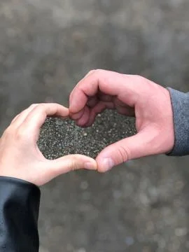Daddy and daughter's hands in the shape of a heart. Stock Photos