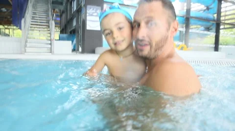 Daddy and son enjoying time at the swimming-pool Stock-Footage 56078126
