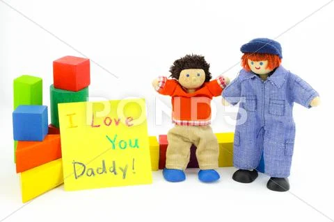 Daddy and son wooden toys with card Stock Photos