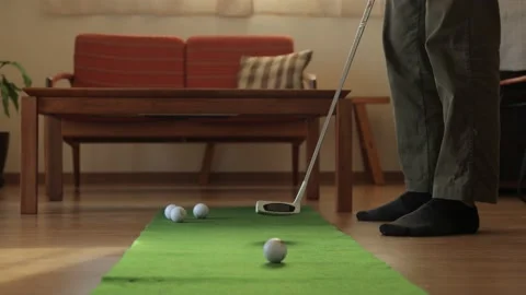 Daddy practicing putting at home. No face. Stock Footage 224905345