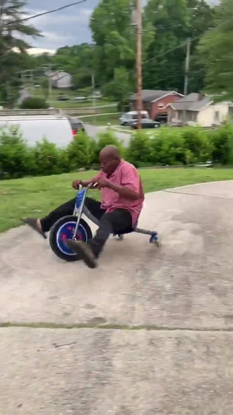 Dad's Big Wheel Fail, High Point, North Carolina, USA - 13 Mar 2022 Stock Footage 205439705