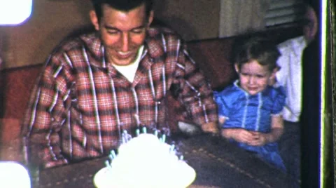 Dads Birthday Party Cake Blows Candles Out 1960s Vintage Film Home Movie 973 Stock Footage