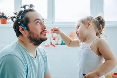 Dad's First Time Putting Makeup on His Daughter Goes Terribly Wrong in the Stock Photos
