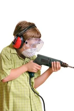Dads Helper boy using a power drill A young boy with a power drill ready t... 스톡 사진