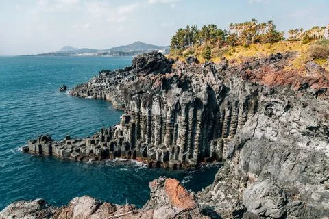 Daepo Jusangjeolli Cliff Columnar Joints and sea in Jeju Island, Korea Stock Photos