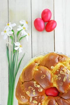 Daffodil flowers,Easter eggs and Easter bread Stock Photos