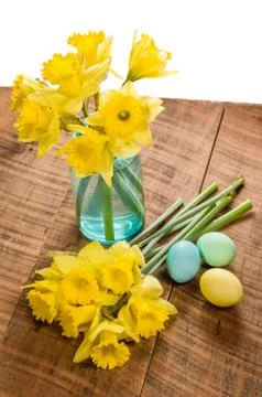 Daffodils and dyed Easter eggs Stock Photos