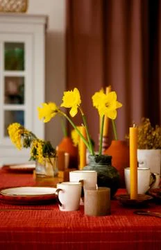 Daffodils in a flower vase on the kitchen table Stock Photos