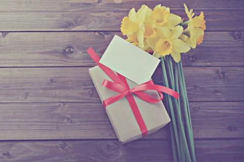 Daffodils with gift box Stock Photos