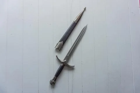 Dagger with holster on white background Stock Photos