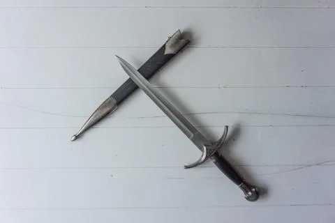 Dagger with holster on white background Stock Photos