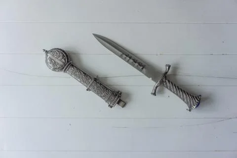 Dagger with holster on white background Stock Photos