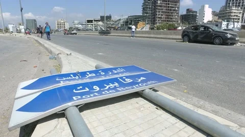 A dagmaged sign that indicates the direction of Beirut Port, Beirut, Lebanon Stock Footage 136790508