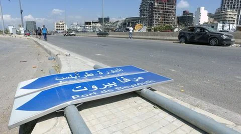 A dagmaged sign that indicates the direction of Beirut Port, Beirut, Lebanon Stock Photos