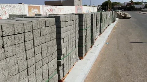 Dahab, Egypt - October 11, 2025: Motion along The Stacks of Concrete Paving Stock Footage 340943858