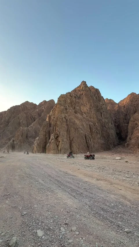 Dahab, Egypt - September 22, 2025: Vertical shot of Tourists riding quad bikes Video stock 341837686