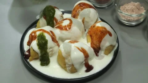Dahi vada, dahi bhalla, chaat, yogurt, Indian snack, spicy, tasty street food Stock Footage 310284399