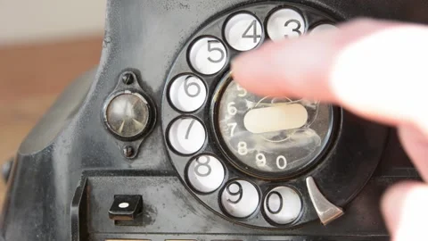 Dailing 411 on an old-fashioned rotary phone to get information Stock Footage 149967845