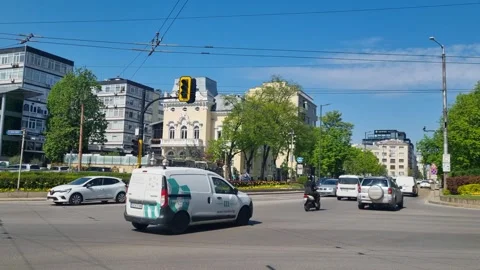Daily car traffic in downtown Sofia, Bulgaria, on a warm sunny spring day under Vídeos de archivo 316110136
